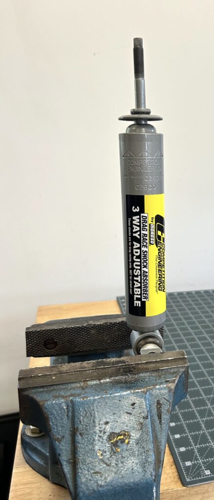 6-438x1024-1 Competition Engineering shock in a vise