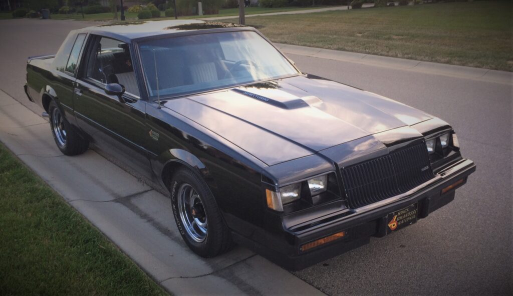 buick-grand-national-ja-passenger-side-1024x592-1 front view of a 1987 buick grand national parked on a street