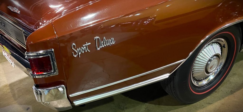 img_6031-1024x471-1 Sport Deluxe Fender emblem on a Canadian Chevy Acadian